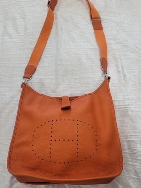 Pebbled Orange Crossbody Bag with Perforated Detail